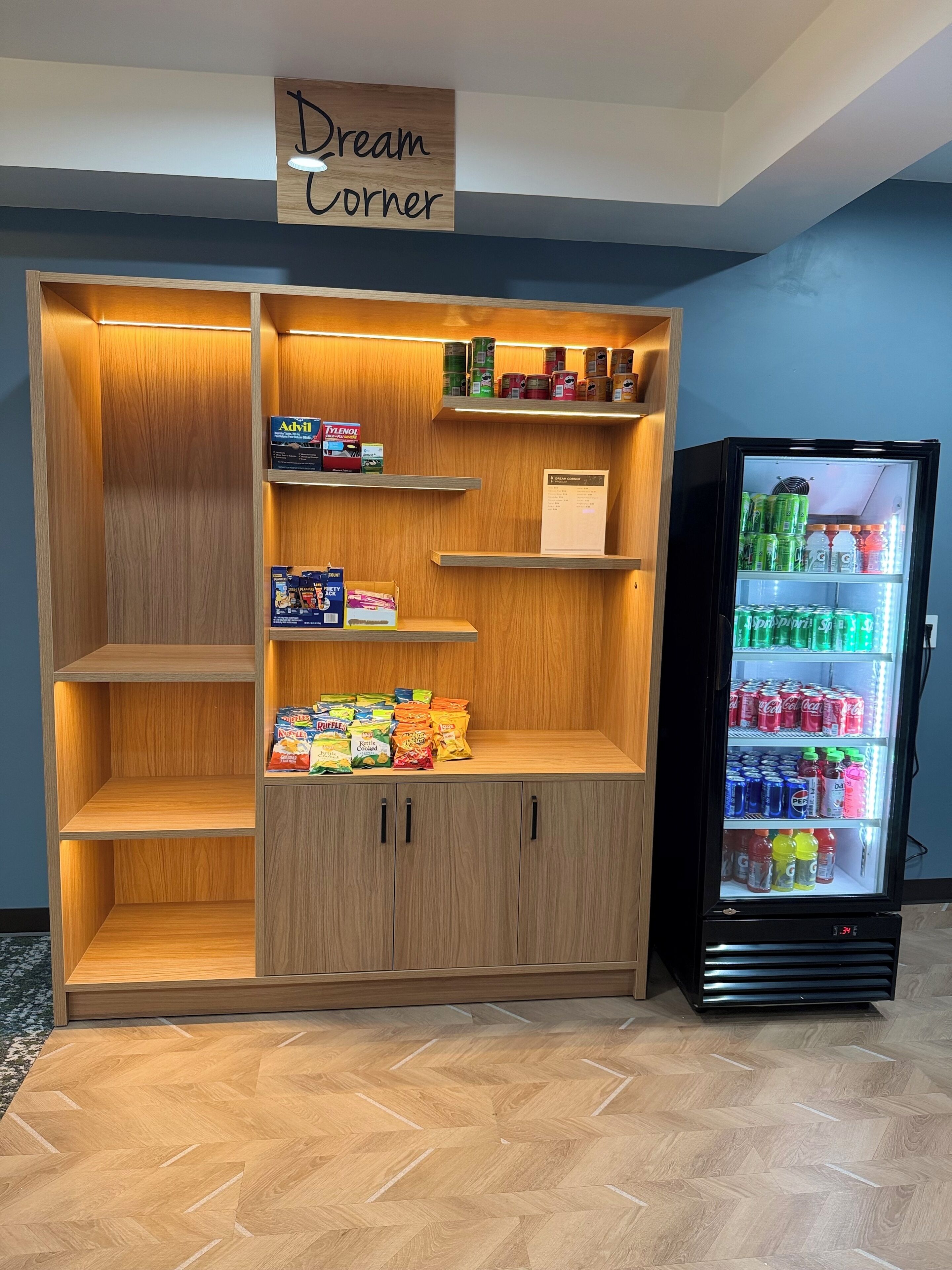 A Dream Corner vending area with snacks, beverages, and a refrigerator.