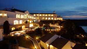 A large, multi-story building with a swimming pool and a staircase leading to the upper levels. - Miyako Resort Shima Bayside Terrace (Shima)