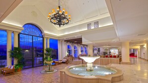 A spacious lobby with a fountain, comfortable seating, and large windows. - Miyako Resort Shima Bayside Terrace (Shima)
