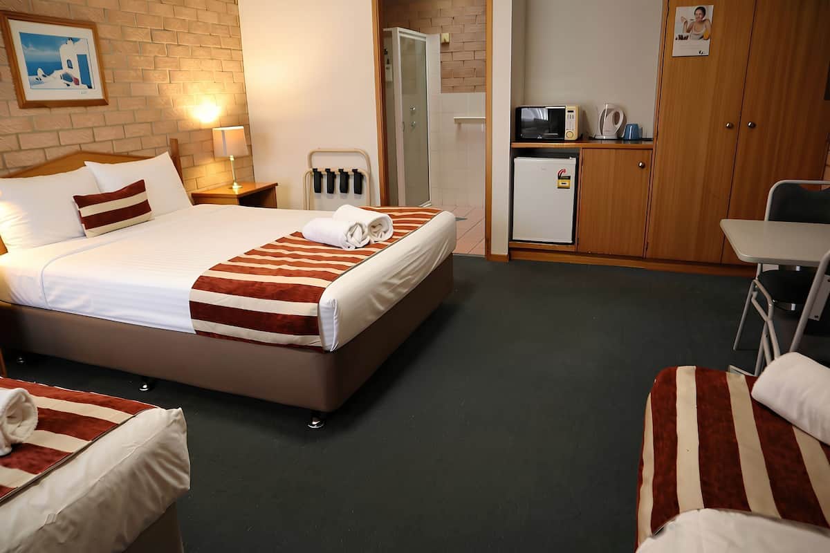 Premium bedding, Tempur-Pedic beds, desk, laptop workspace