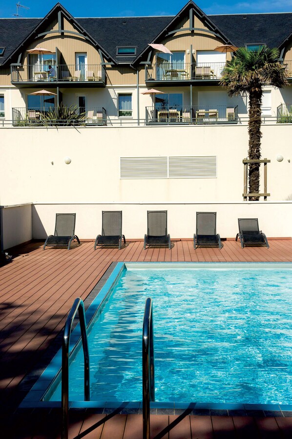 Indoor pool, seasonal outdoor pool, open 10 AM to 7 PM, pool loungers