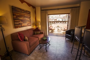Luxury Suite | Living area | 32-inch LCD TV with cable channels, TV