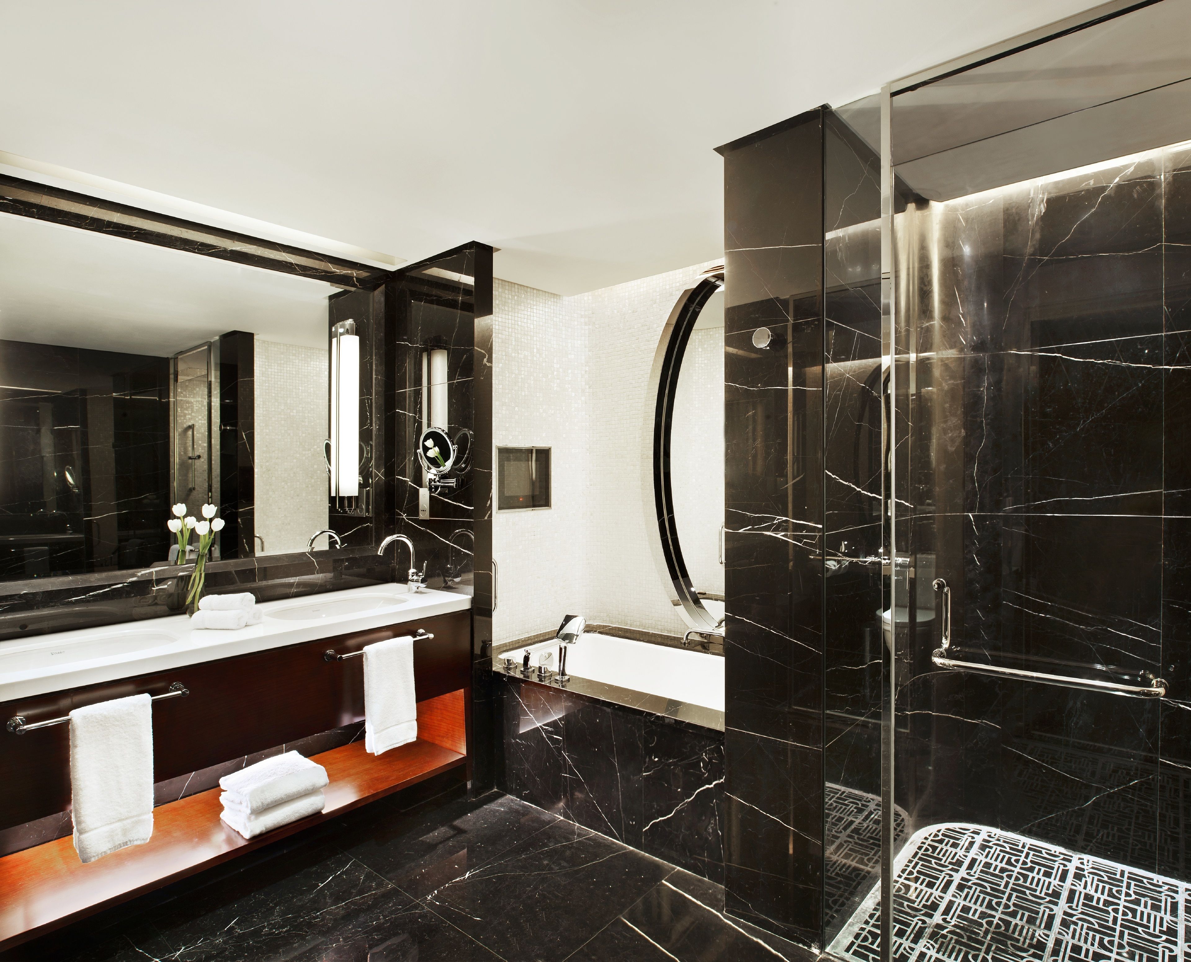 separate bathtub and shower, hair dryer, slippers, towels