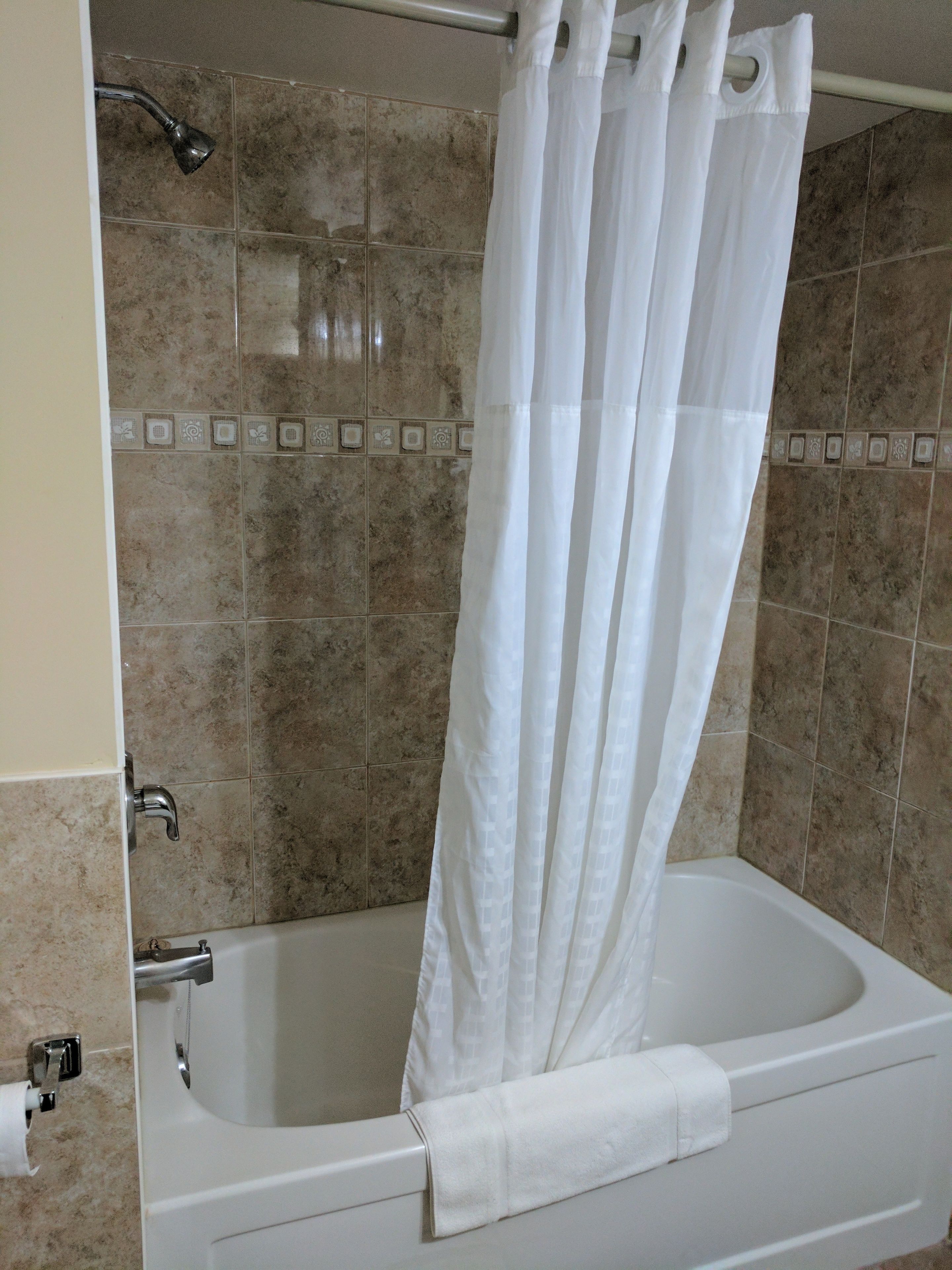 deep-soaking bathtub, hair dryer, towels