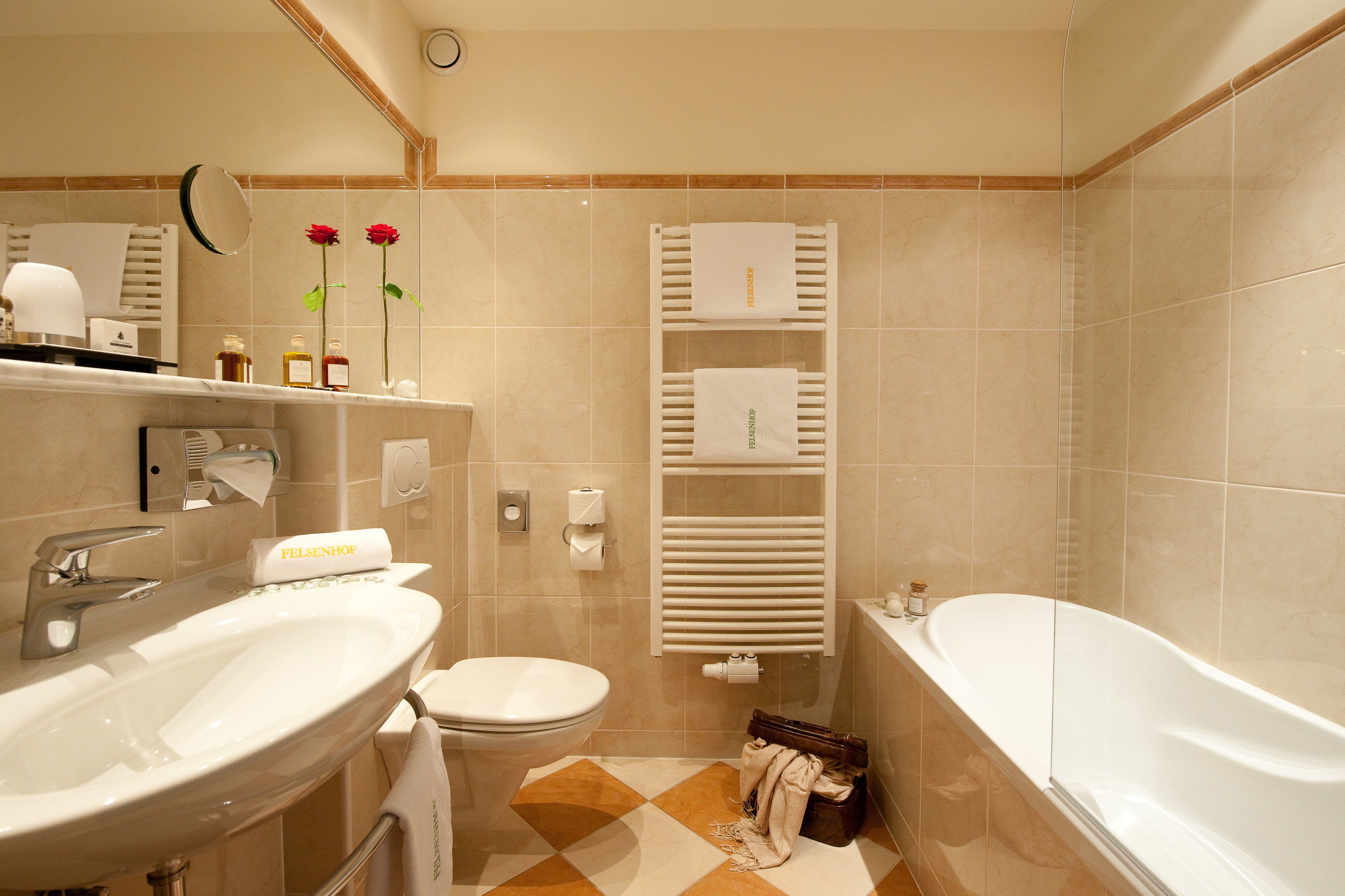 designer toiletries, hair dryer, bathrobes, towels