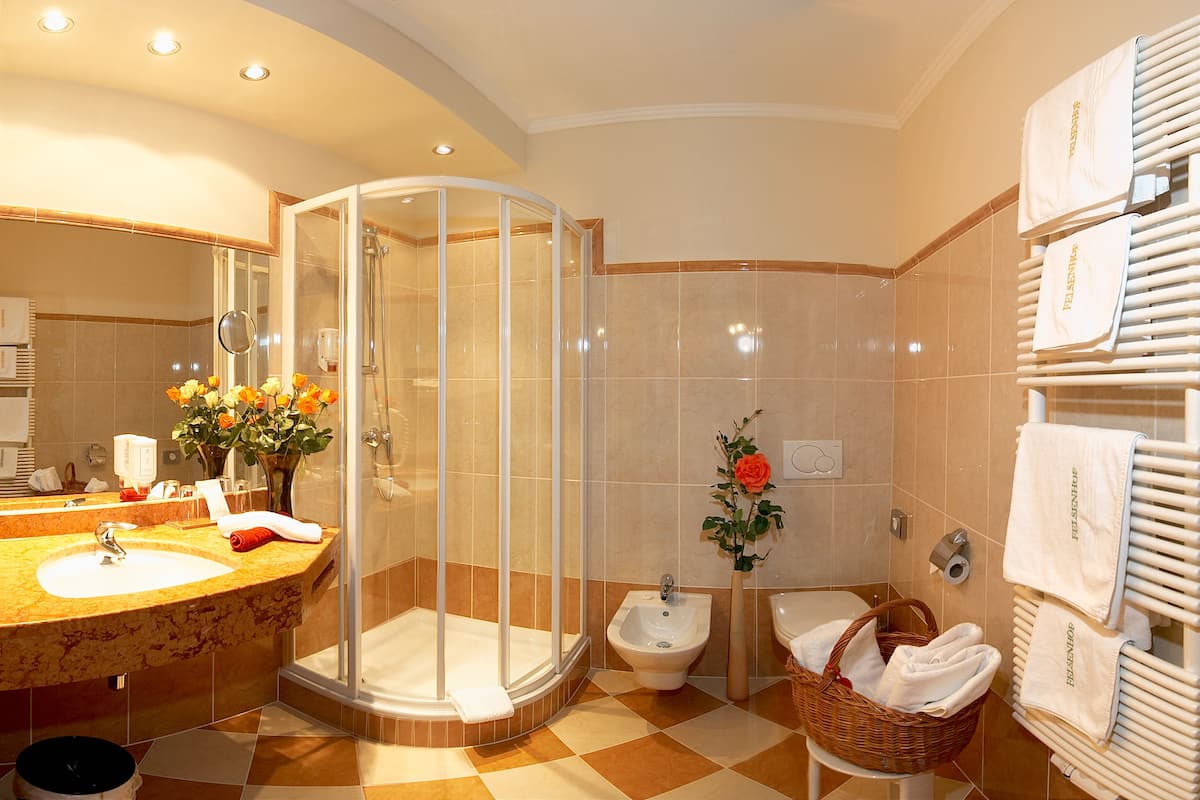 designer toiletries, hair dryer, bathrobes, towels