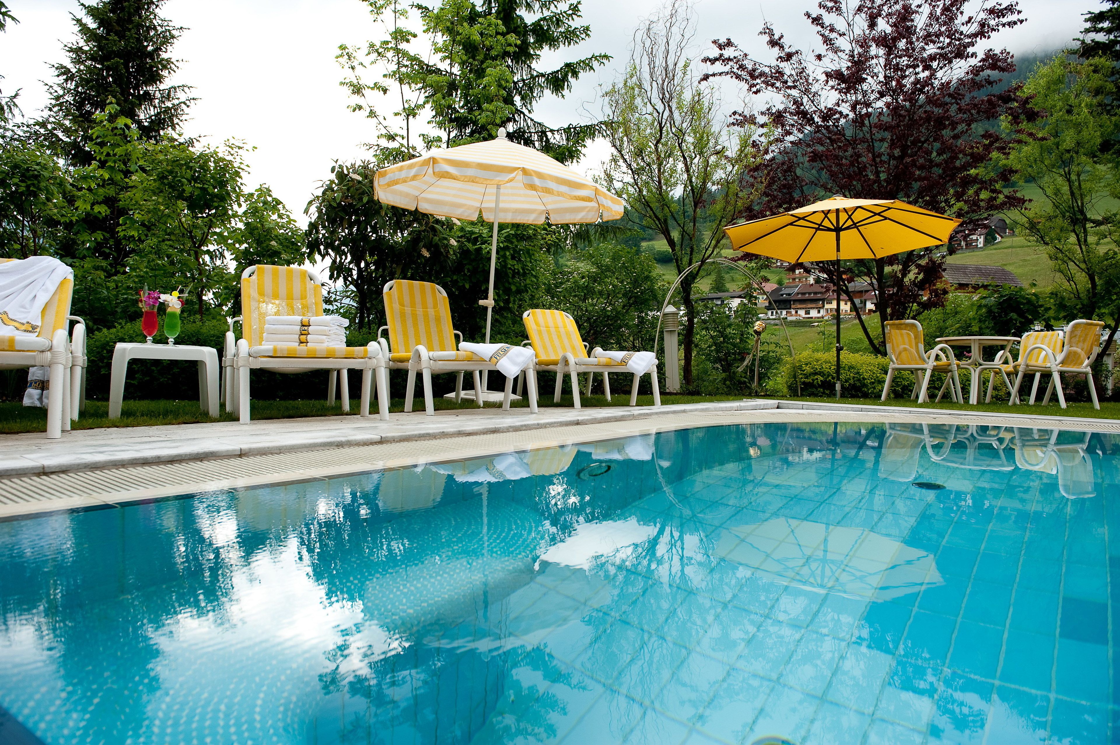 indoor pool, seasonal outdoor pool, pool umbrellas, pool loungers