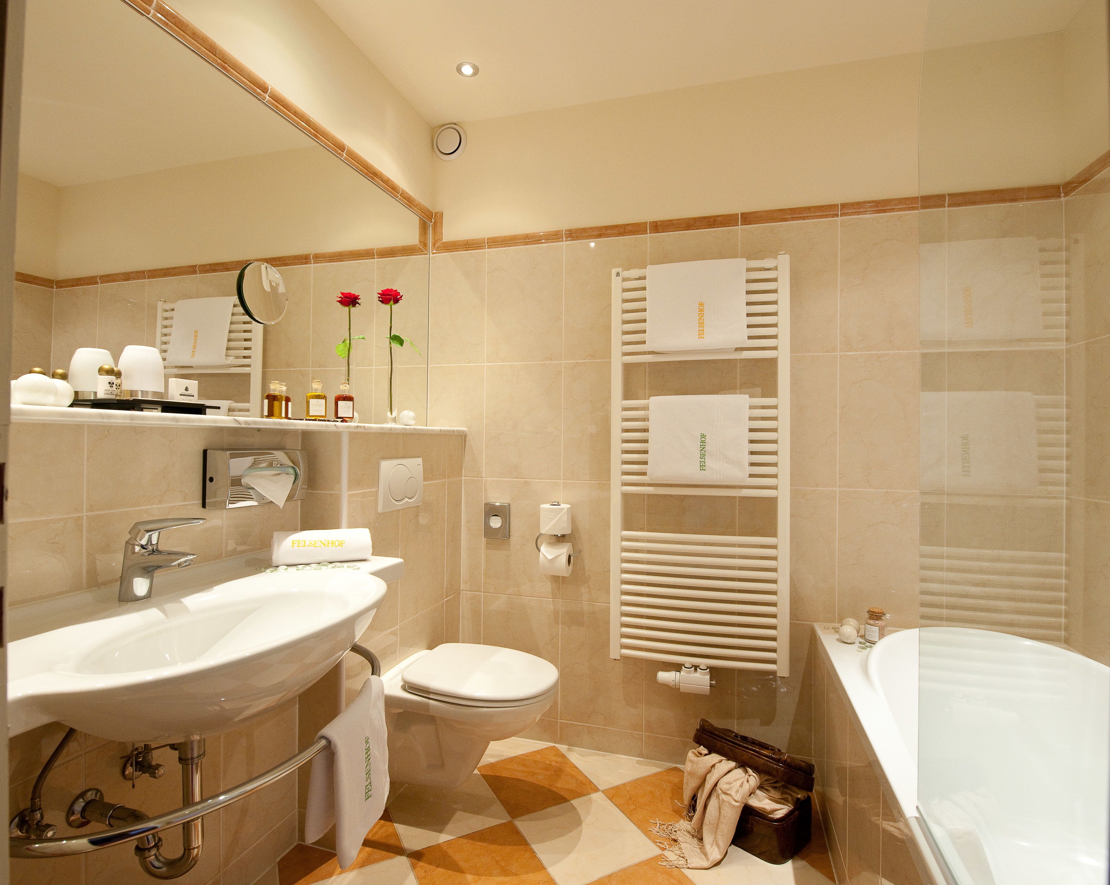 designer toiletries, hair dryer, bathrobes, towels