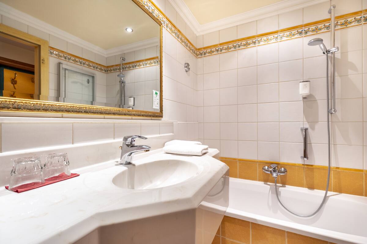 designer toiletries, hair dryer, bathrobes, slippers