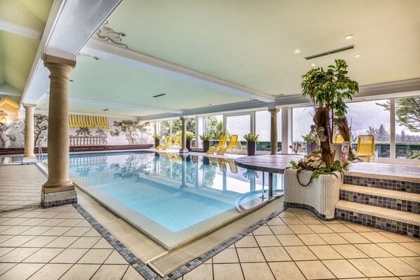 Indoor pool, pool umbrellas, sun loungers
