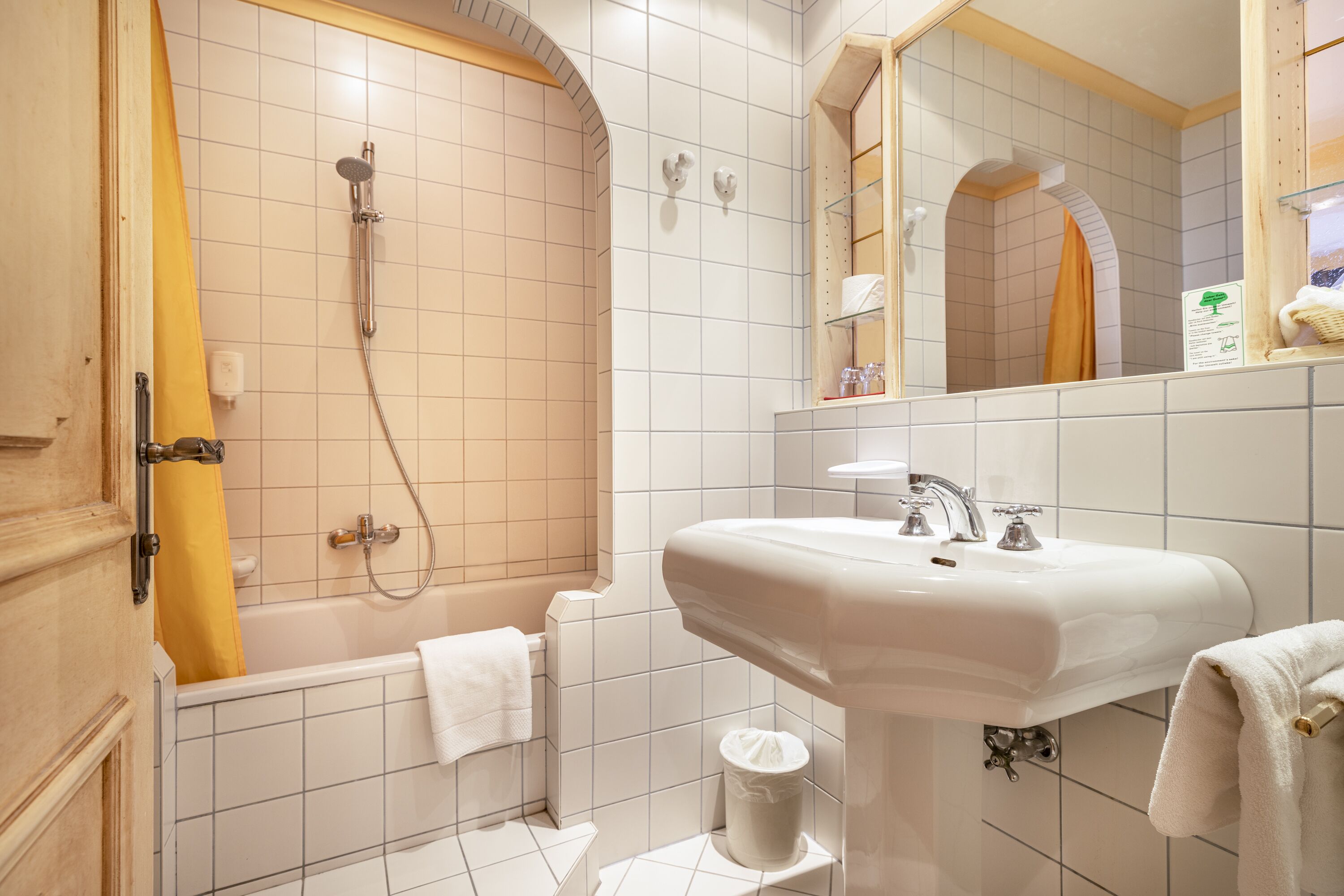 designer toiletries, hair dryer, bathrobes, slippers