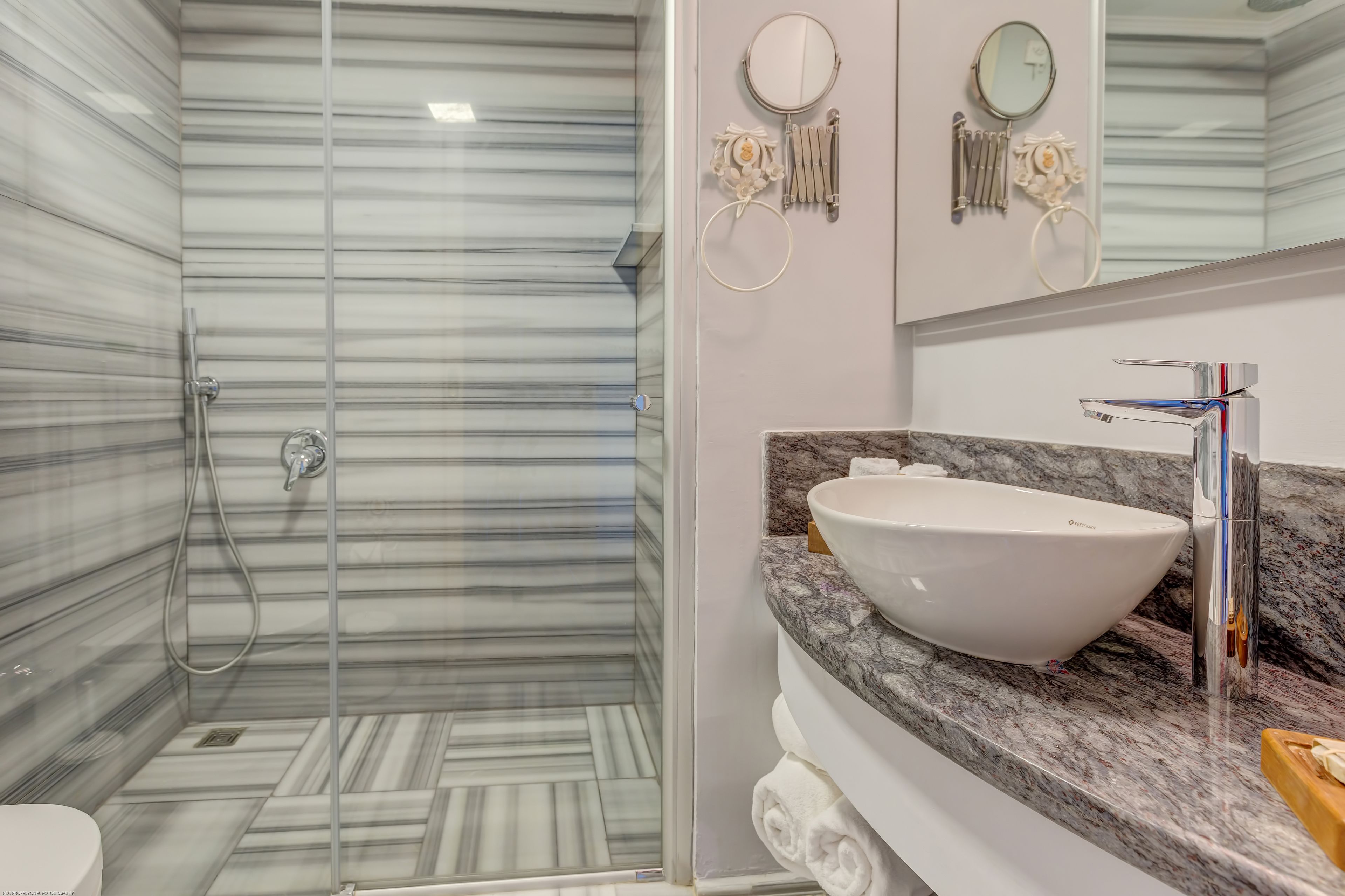family room | bathroom | shower, rainfall showerhead, eco-friendly toiletries, hair dryer