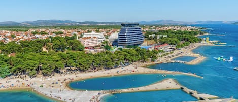 On the beach, sun loungers, beach umbrellas, scuba diving