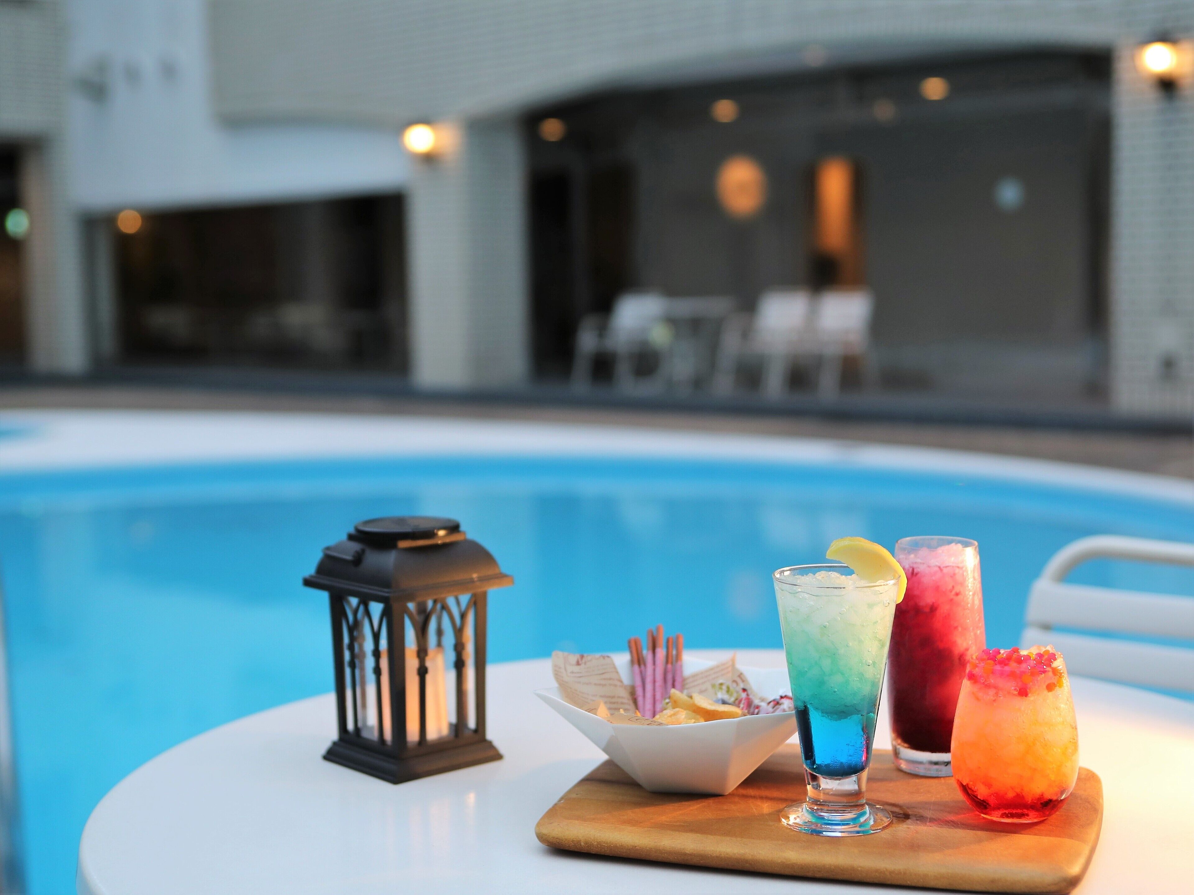 outdoor pool, open 9:00 am to 5:00 pm, pool umbrellas