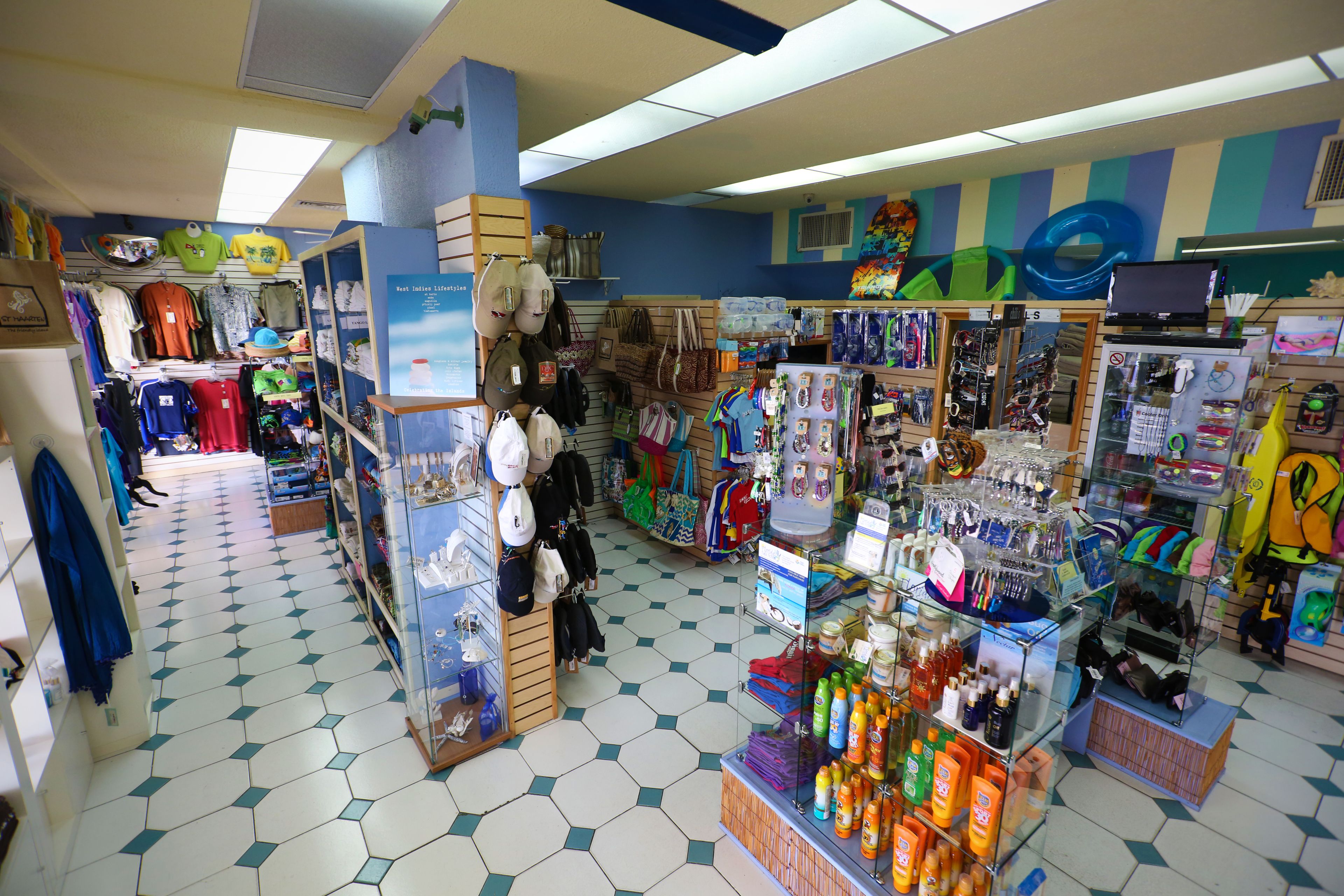 A store with various items on display including clothing, bags, and household goods.