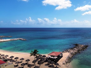 On the beach, sun-loungers, beach umbrellas, beach towels