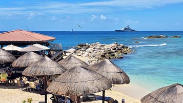 On the beach, sun loungers, beach umbrellas, beach towels