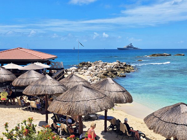 On the beach, sun-loungers, beach umbrellas, beach towels