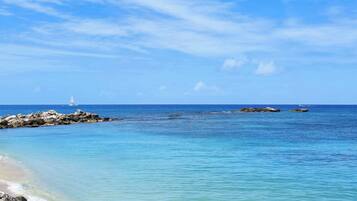 On the beach, sun-loungers, beach umbrellas, beach towels