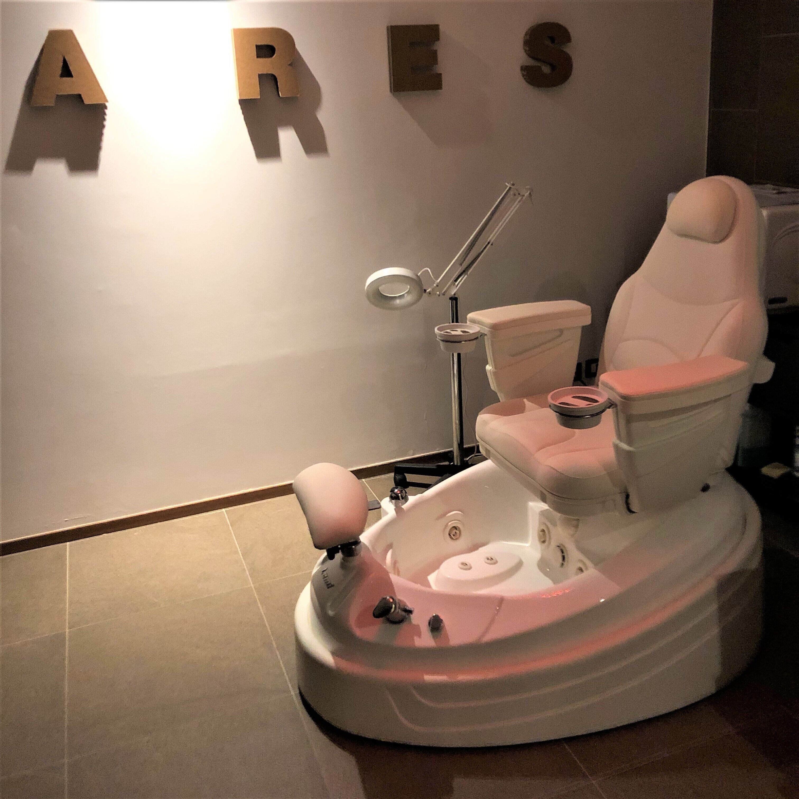 A modern bathroom with a unique, elevated toilet design.