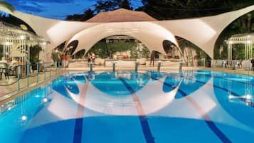 Seasonal outdoor pool, open 10:00 AM to 6:00 PM, pool umbrellas