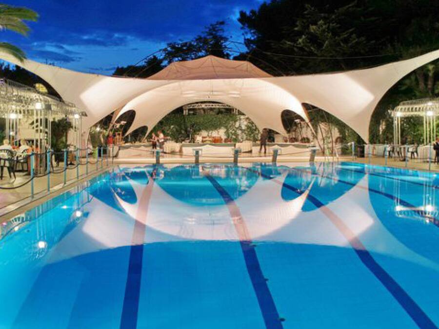 Seasonal outdoor pool, open 10:00 AM to 6:00 PM, pool umbrellas