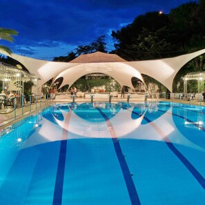 Seasonal outdoor pool, open 10:00 AM to 6:00 PM, pool umbrellas