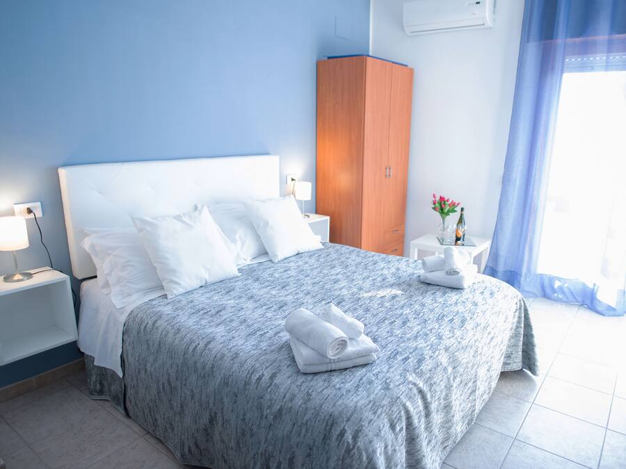 Economy Quadruple Room, Private Bathroom | Down comforters, rollaway beds, free WiFi, bed sheets