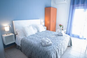 Economy Quadruple Room, Private Bathroom | Down comforters, rollaway beds, free WiFi, bed sheets