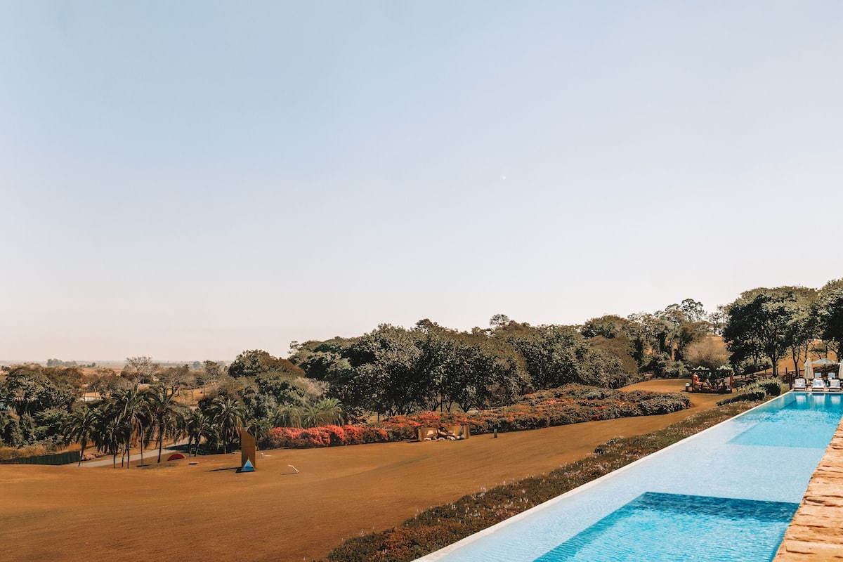 indoor pool, outdoor pool, pool umbrellas, pool loungers