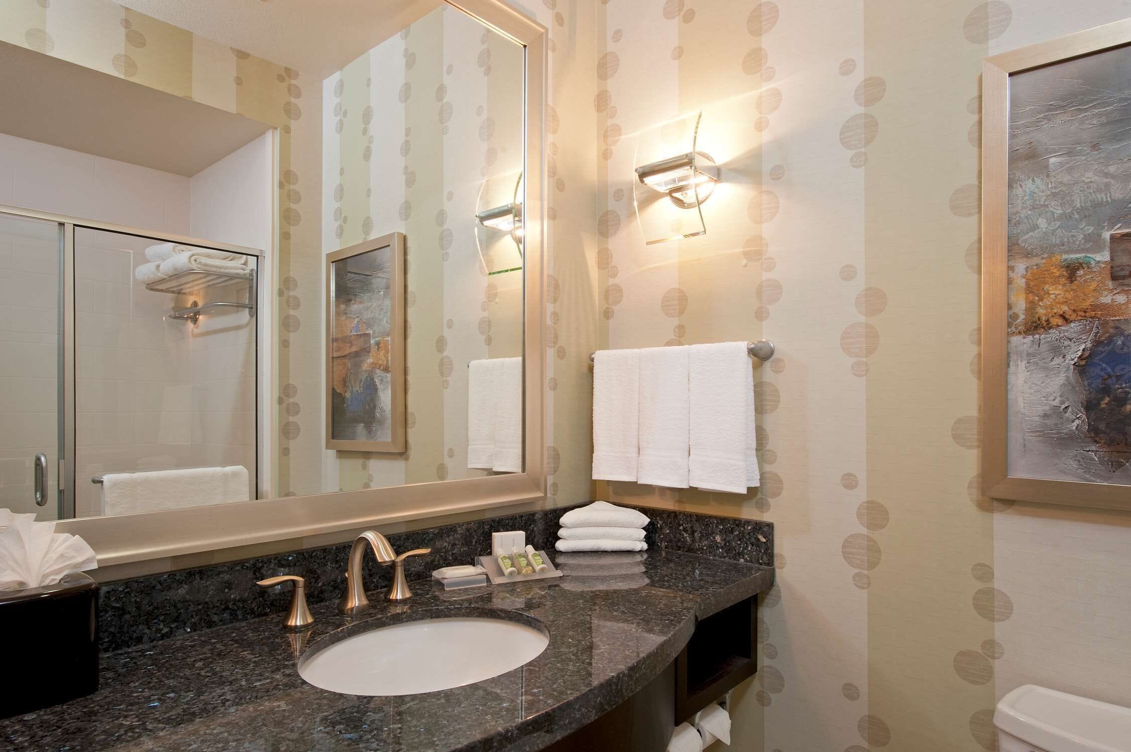 combined shower/bathtub, deep-soaking bathtub, designer toiletries