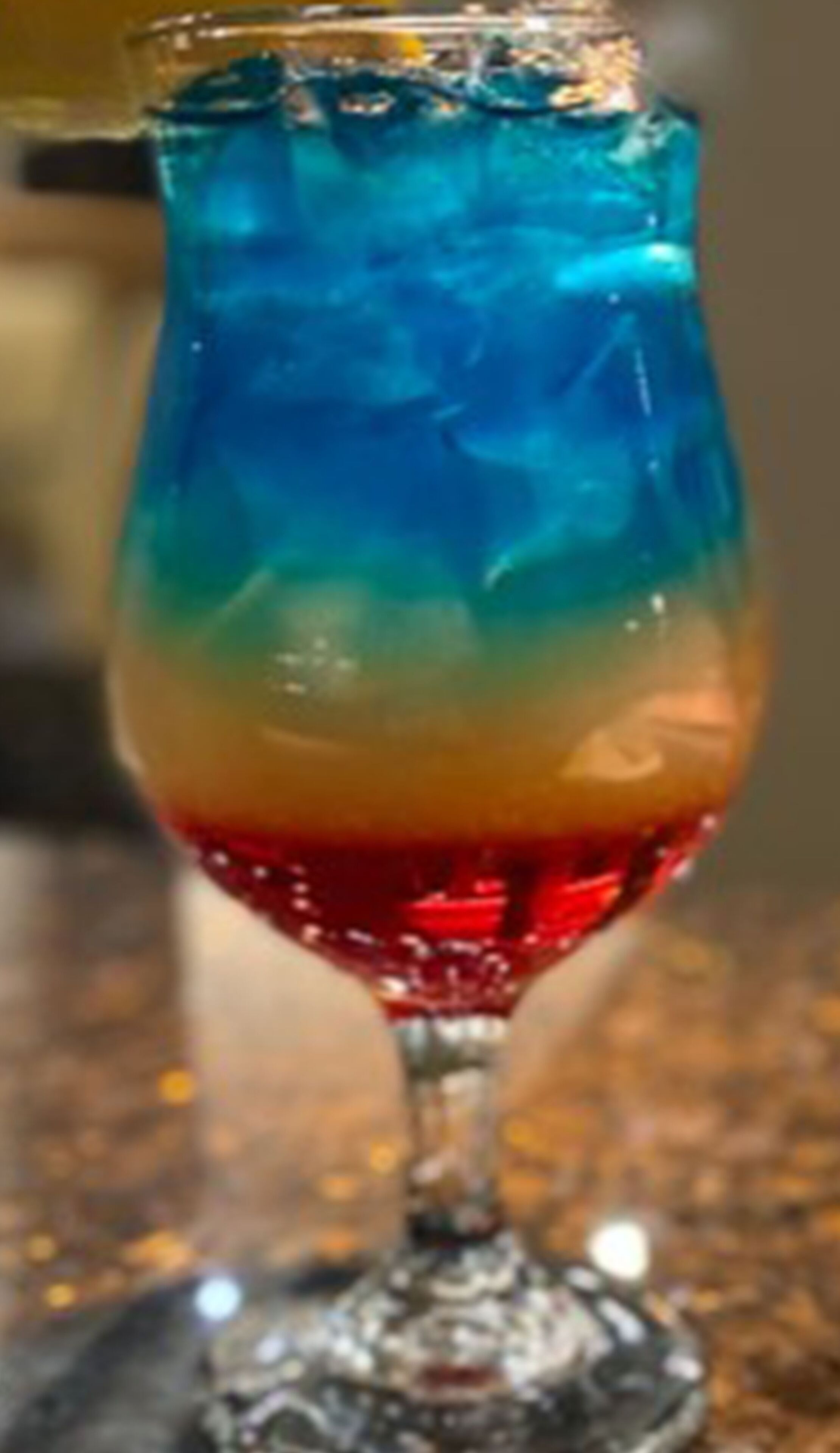 A glass with layered colors.