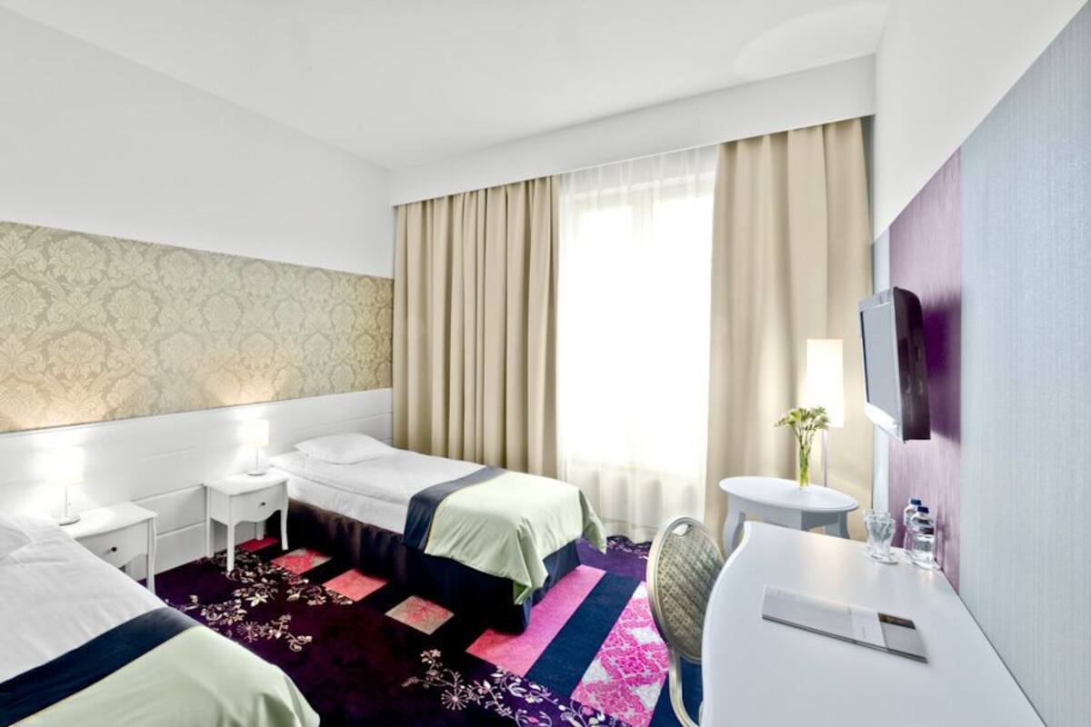 Premium bedding, down comforters, desk, iron/ironing board (on request)