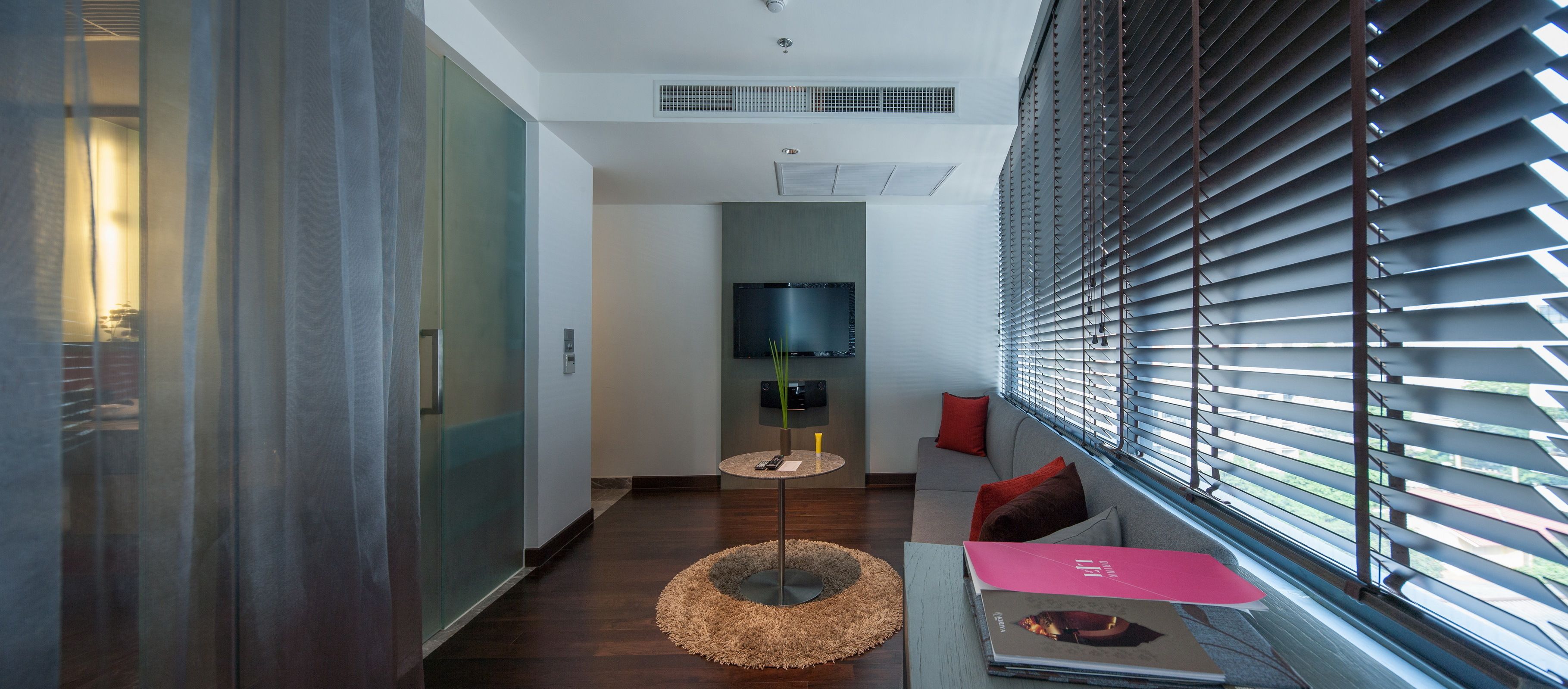 premier suite (full spectrum suite) | living area | lcd tv