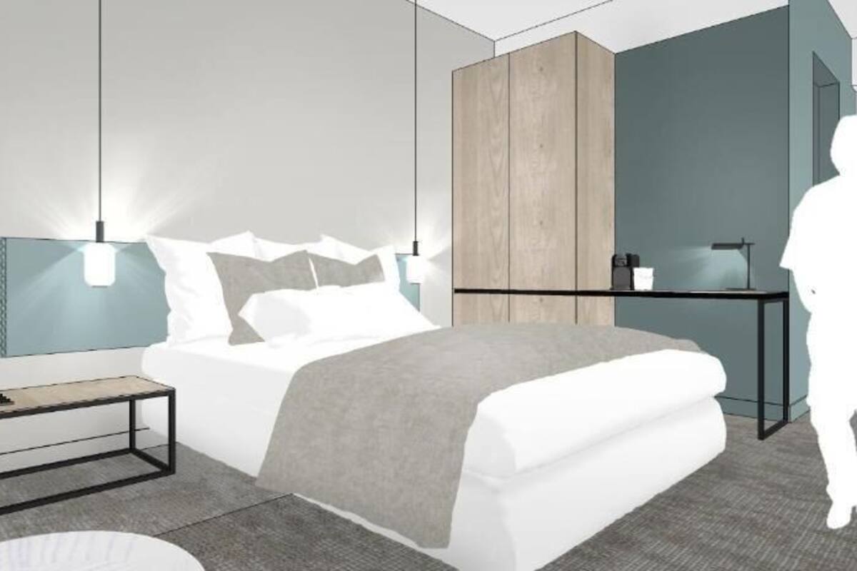 A modern bedroom with a bed, bedside tables, a wardrobe, and a desk.