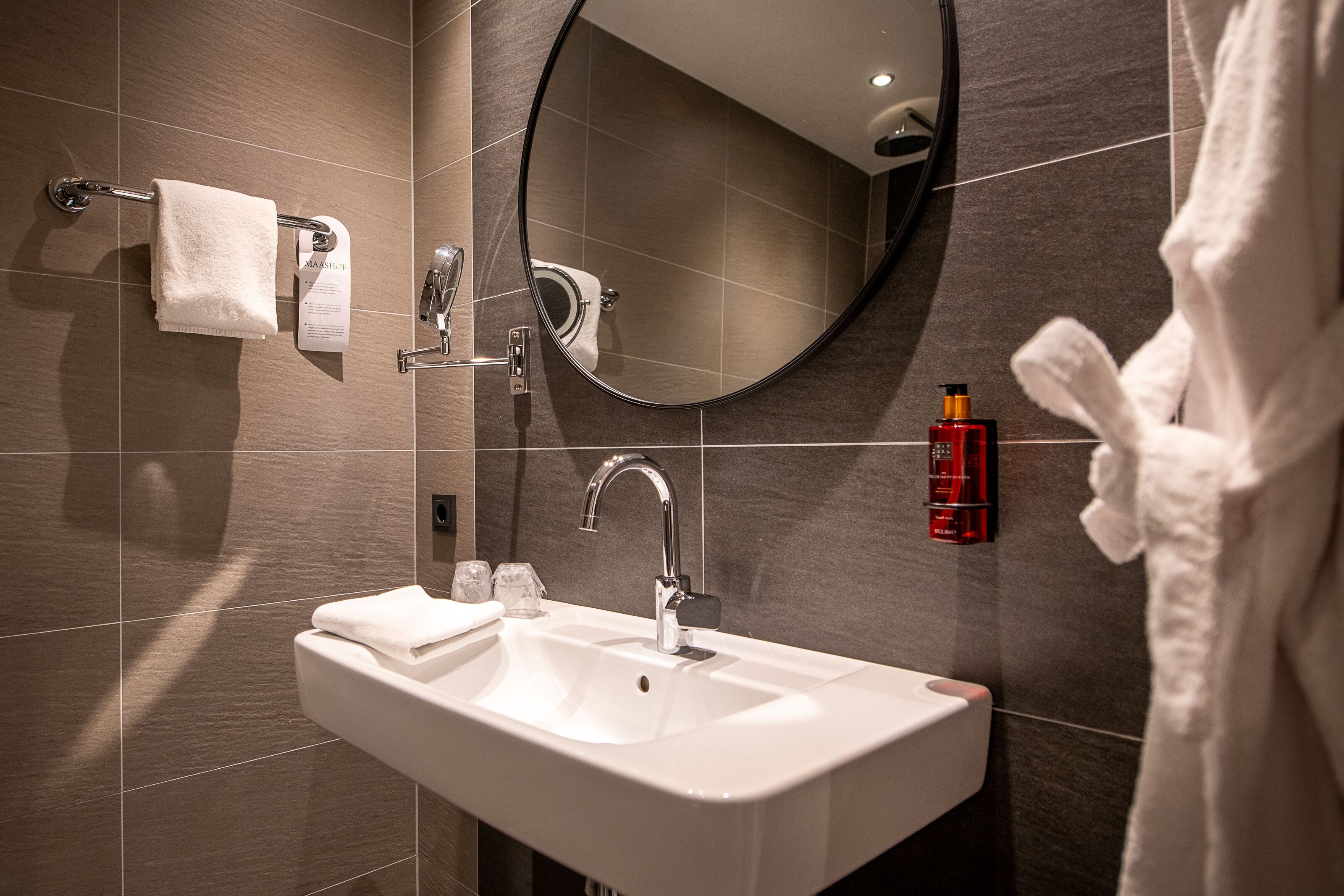 deluxe room | bathroom | shower, hair dryer, towels