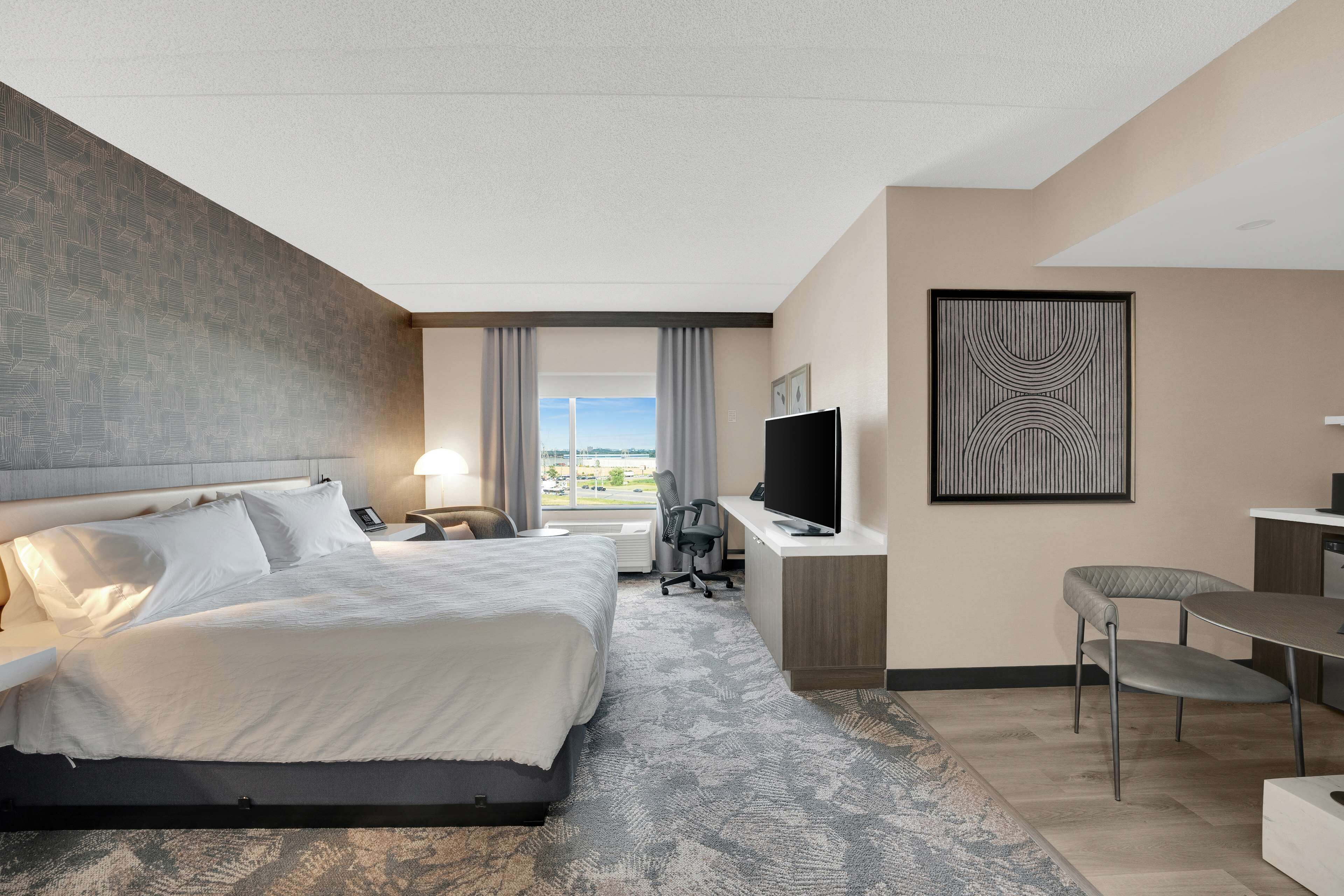 deluxe room, 1 king bed | in-room safe, iron/ironing board, free cots/infant beds, rollaway beds