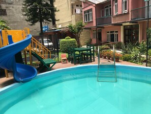 Outdoor pool, sun loungers - Acme Guest House (Kathmandu)