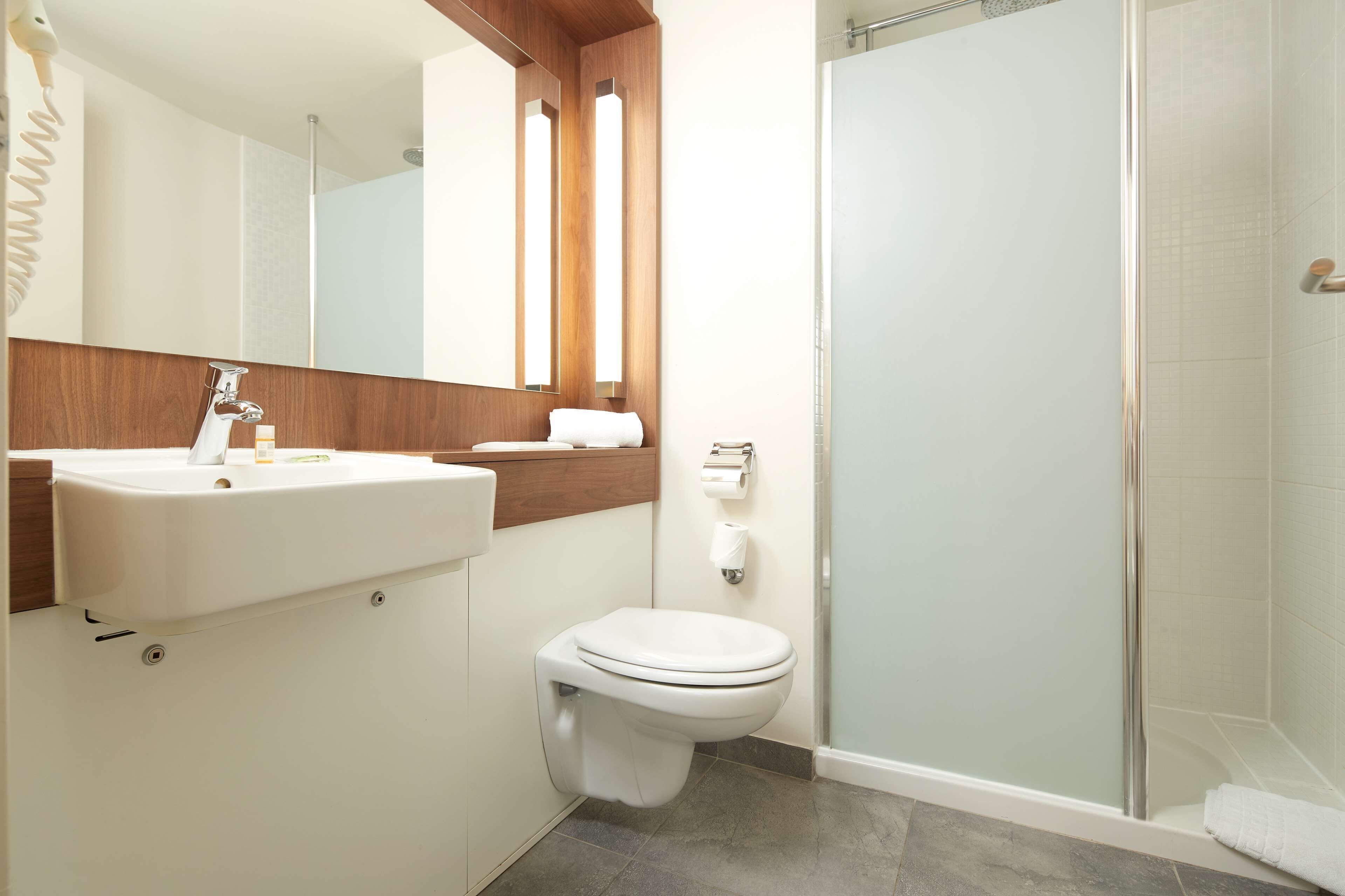 rainfall showerhead, eco-friendly toiletries, hair dryer, towels