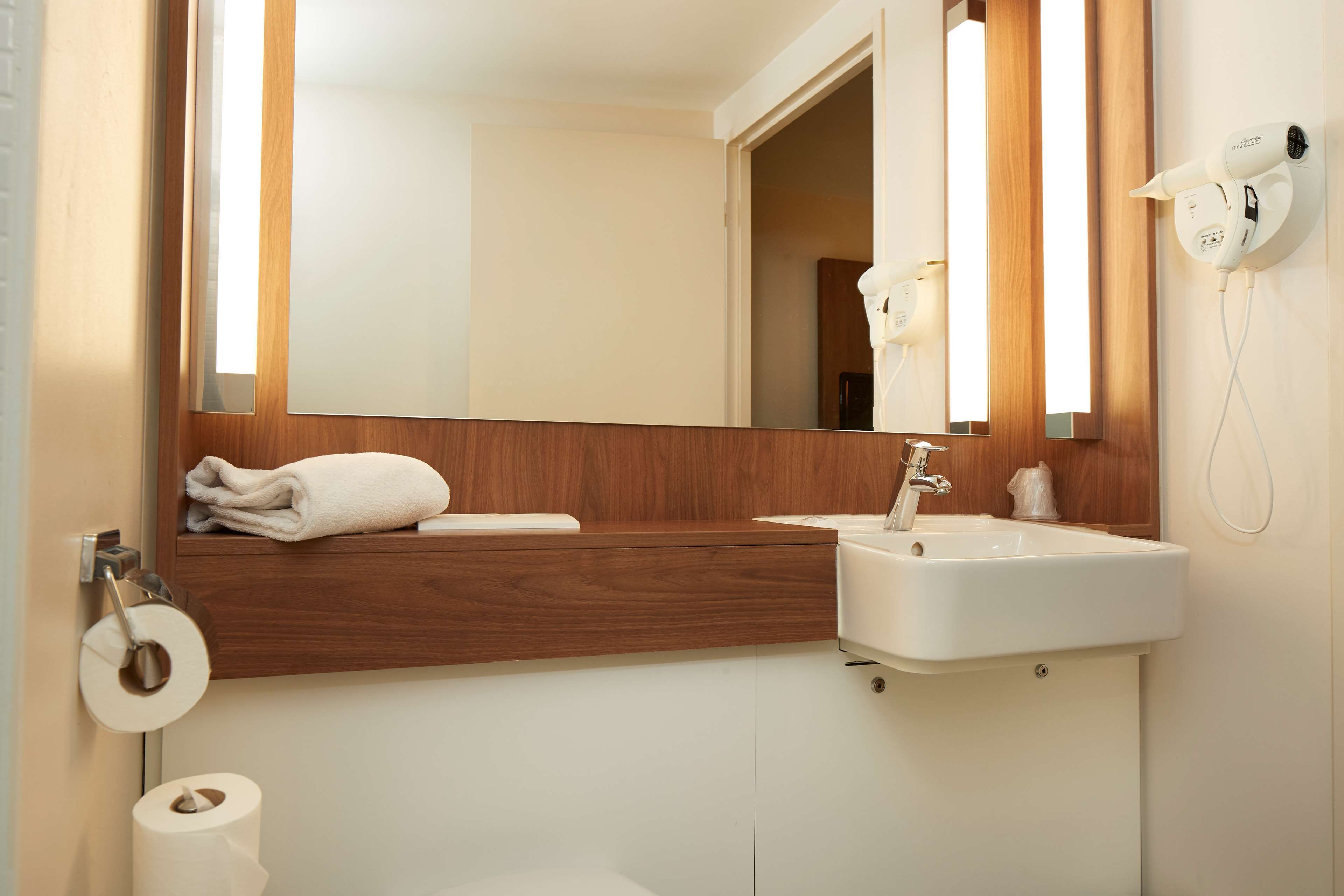 rainfall showerhead, eco-friendly toiletries, hair dryer, towels