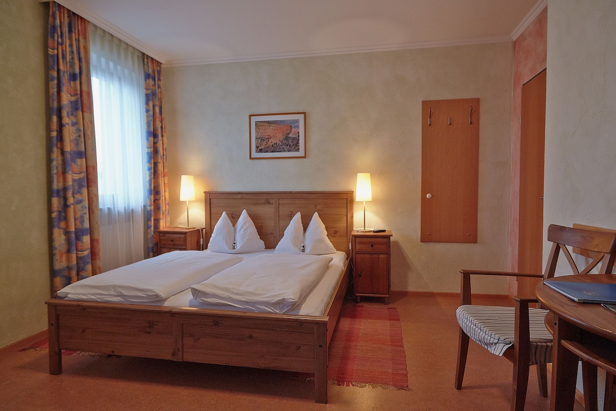 Premium bedding, desk, blackout drapes, iron/ironing board (on request)