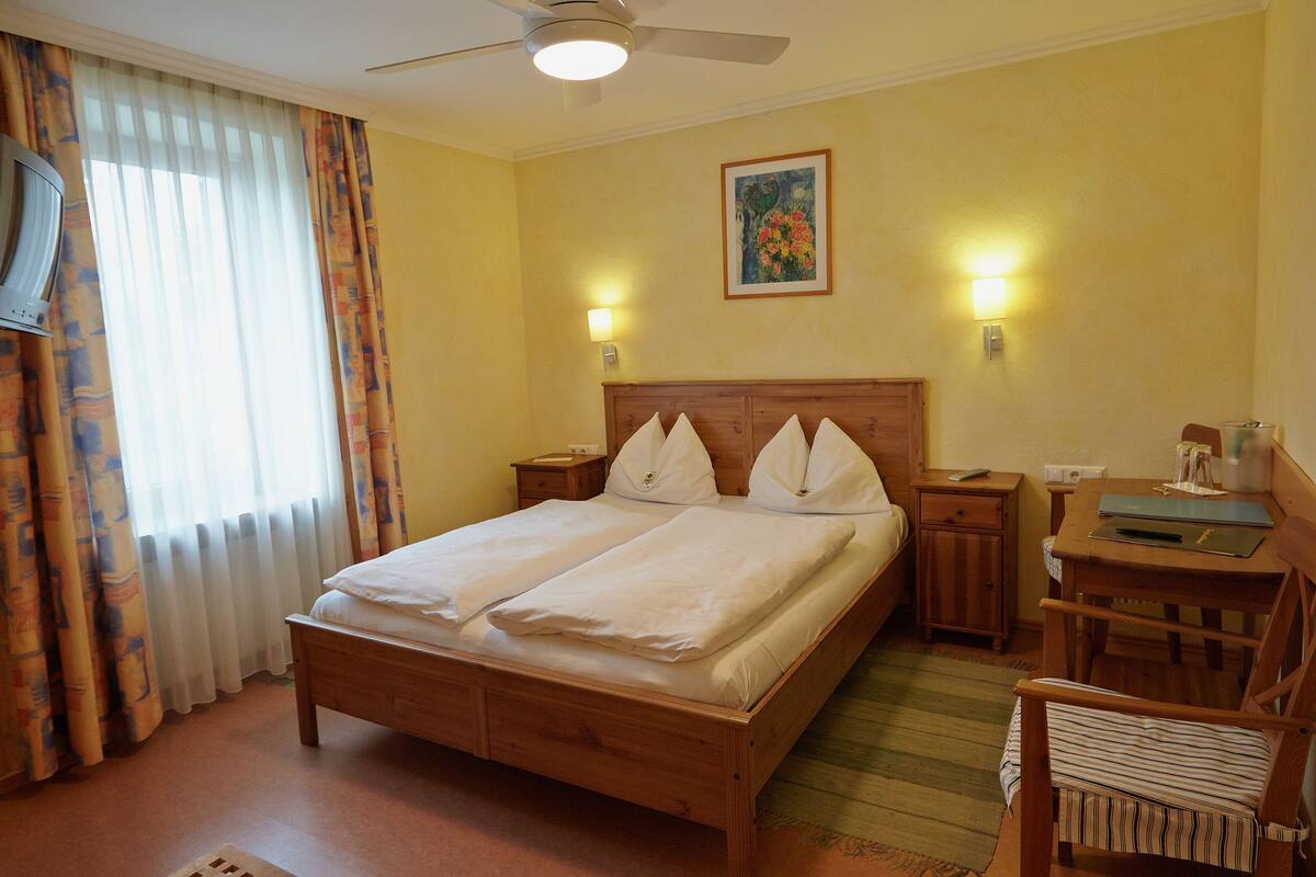 Comfort Double Room Single Use | Premium bedding, desk, blackout drapes, iron/ironing board (on request)