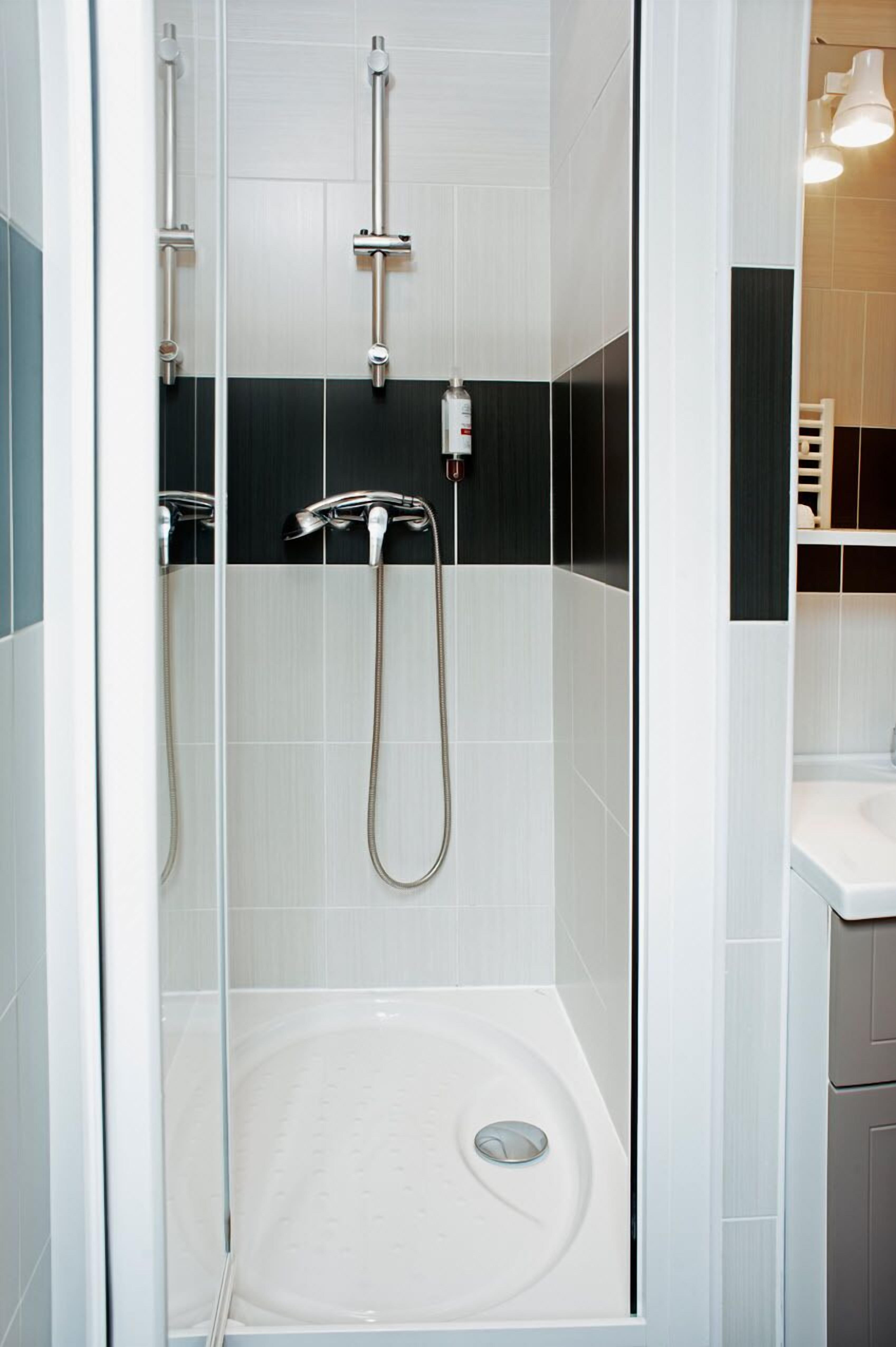 comfort room | bathroom | shower, hair dryer, dressing gowns, slippers