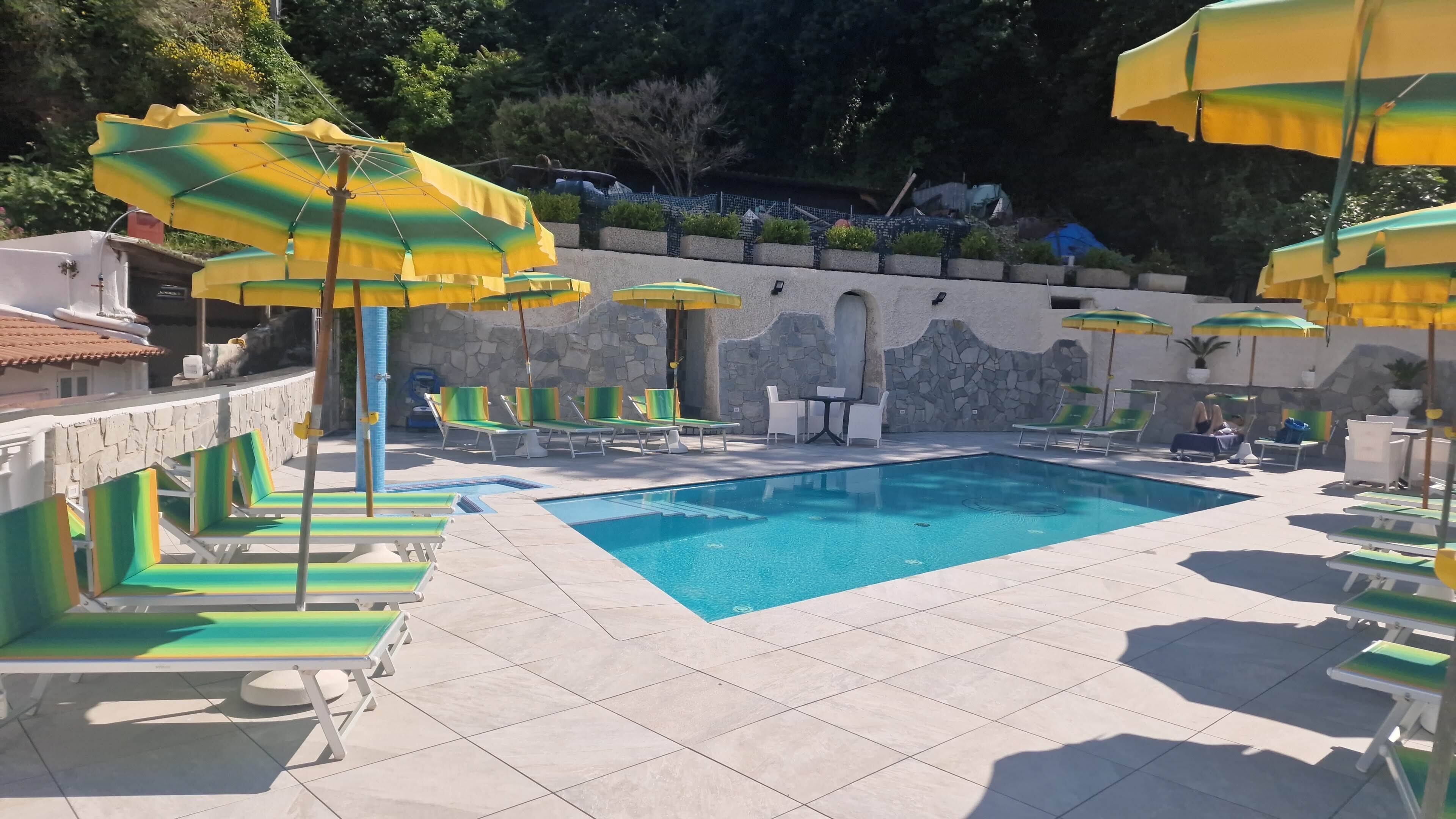 seasonal outdoor pool, open 9:00 am to 7:30 pm, pool umbrellas