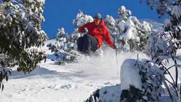 A person skiing on a snow-covered slope.