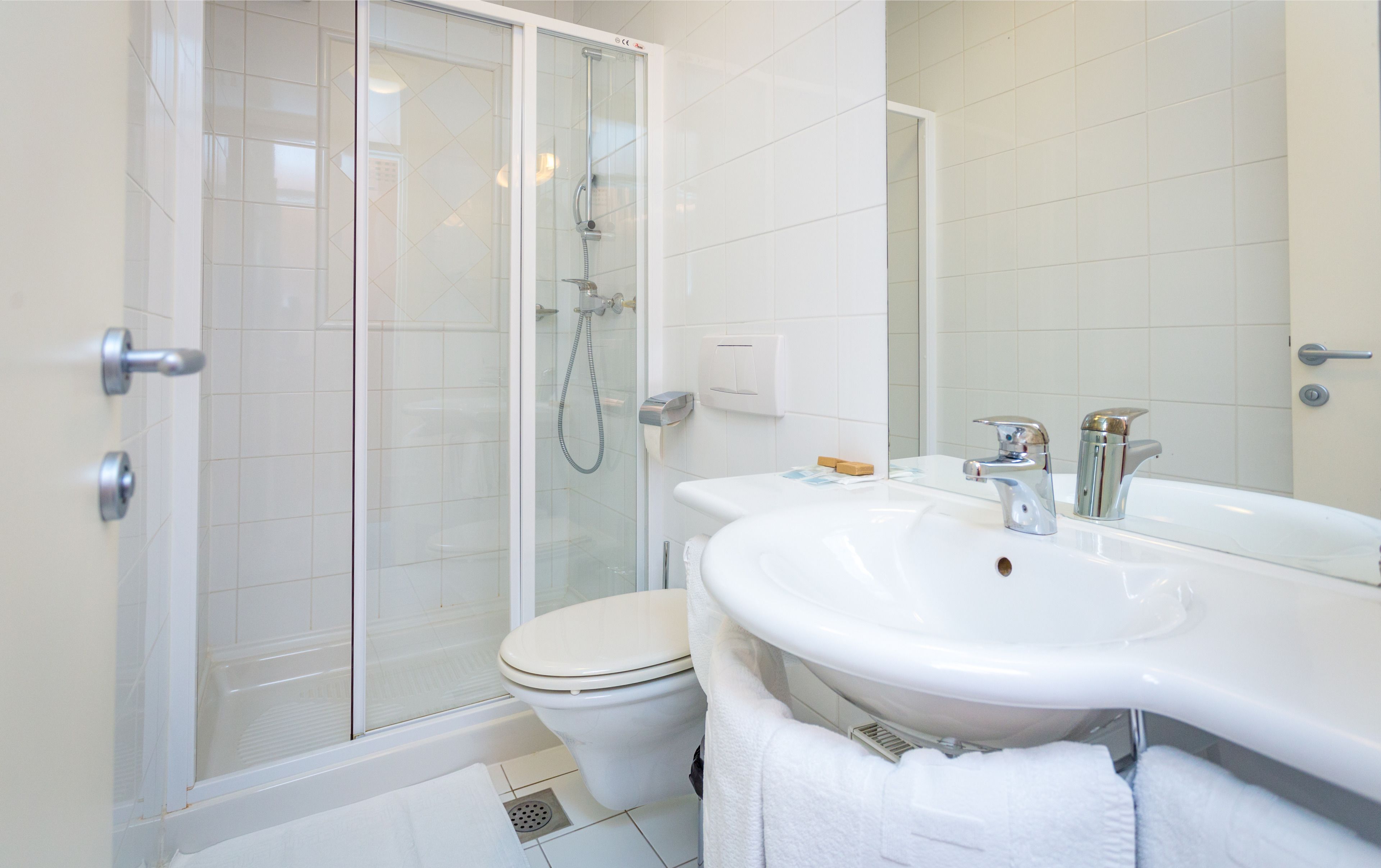 superior double room | bathroom | shower, free toiletries, hair dryer, towels
