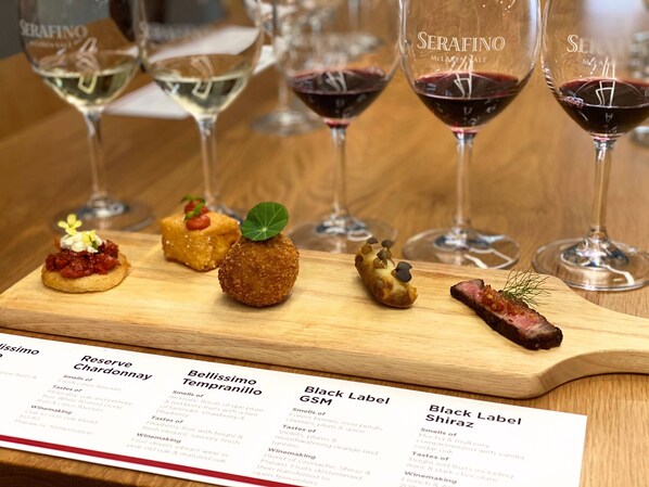 A menu with various wine pairings and descriptions.