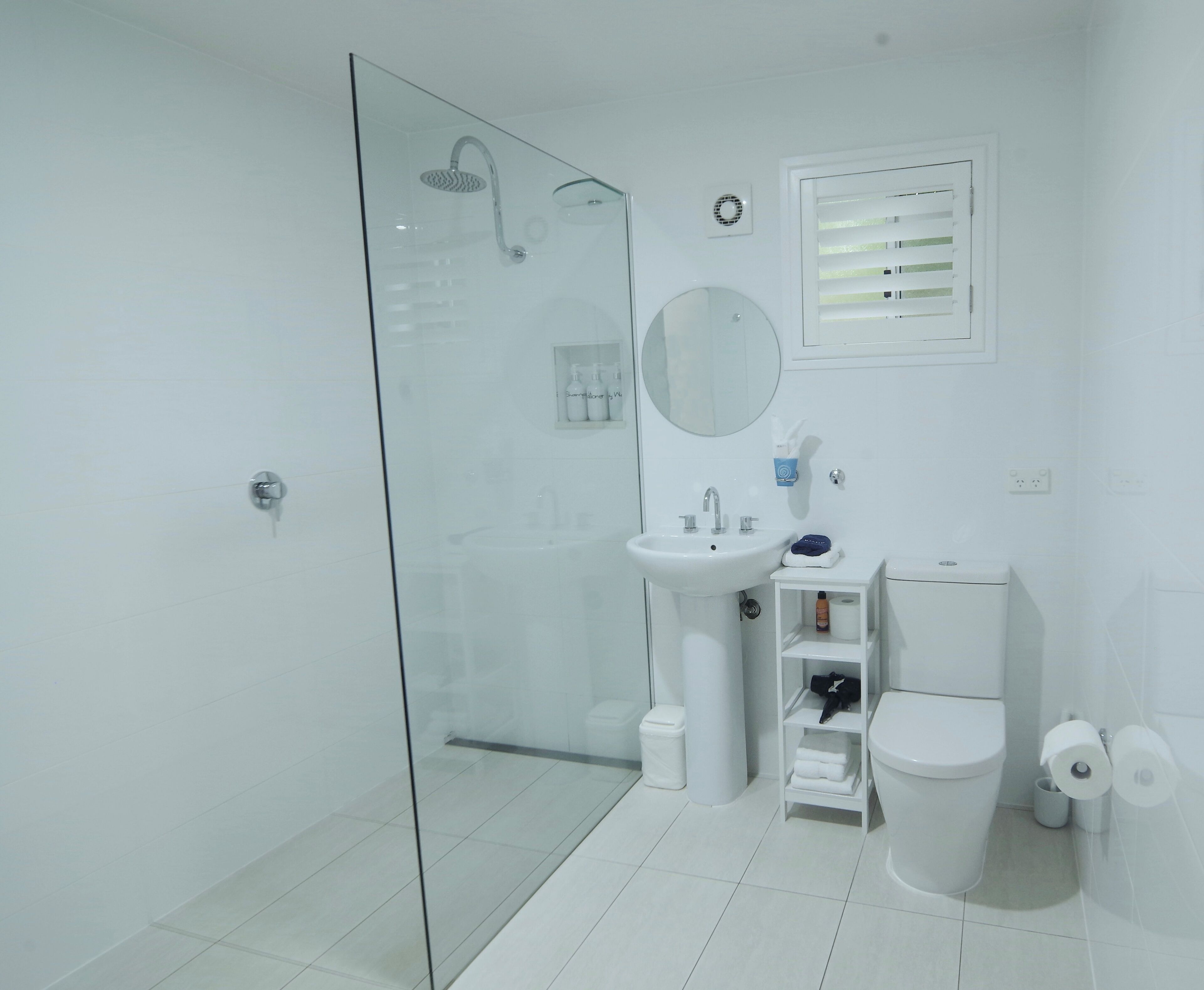 Shower, rainfall showerhead, hair dryer, towels