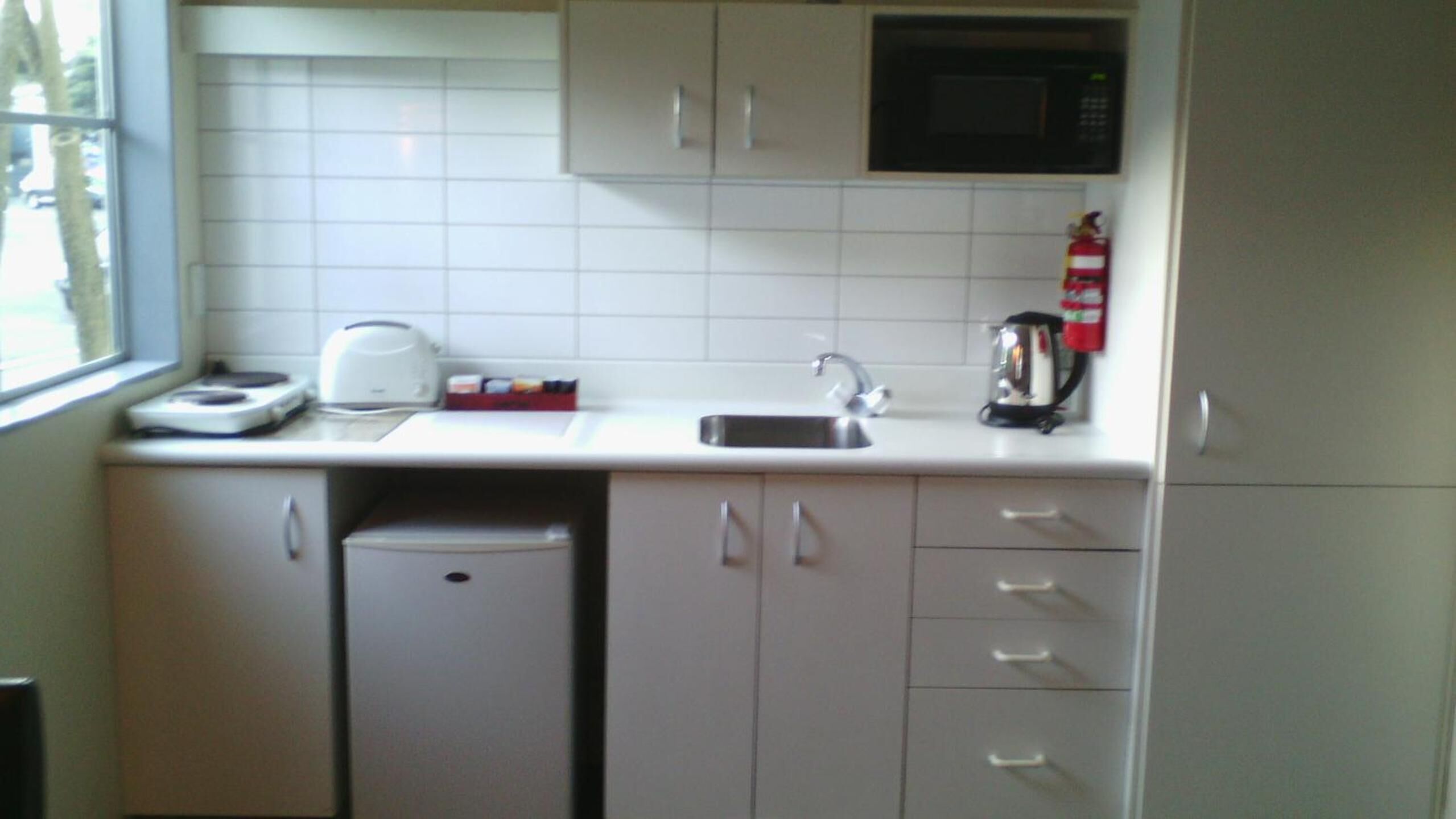 Fridge, microwave, stovetop, coffee/tea maker