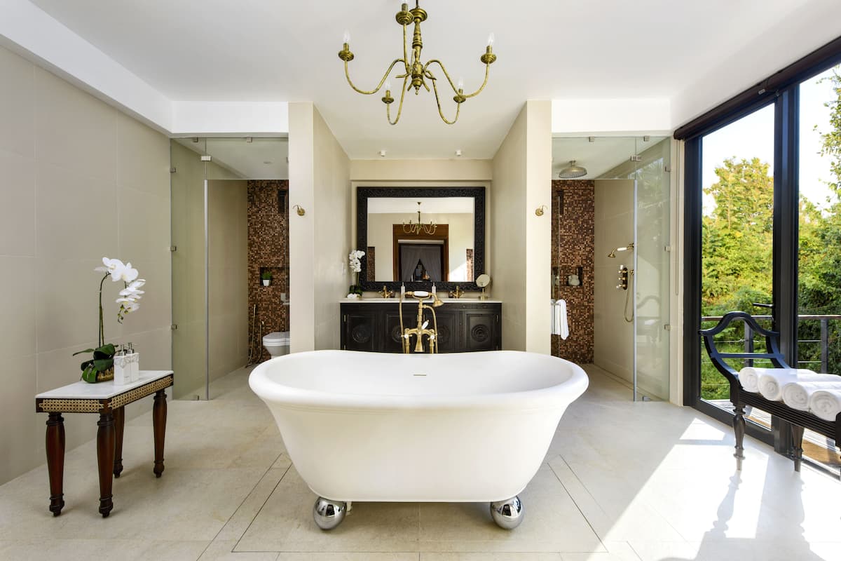 deluxe one bedroom pool villa | bathroom | hydromassage showerhead, free toiletries, hair dryer, bathrobes